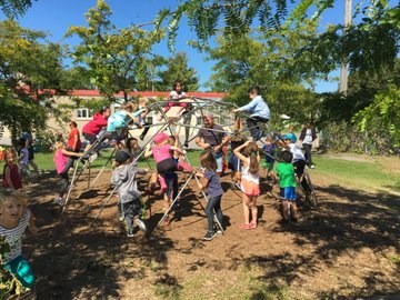 Children playing on a play structure.