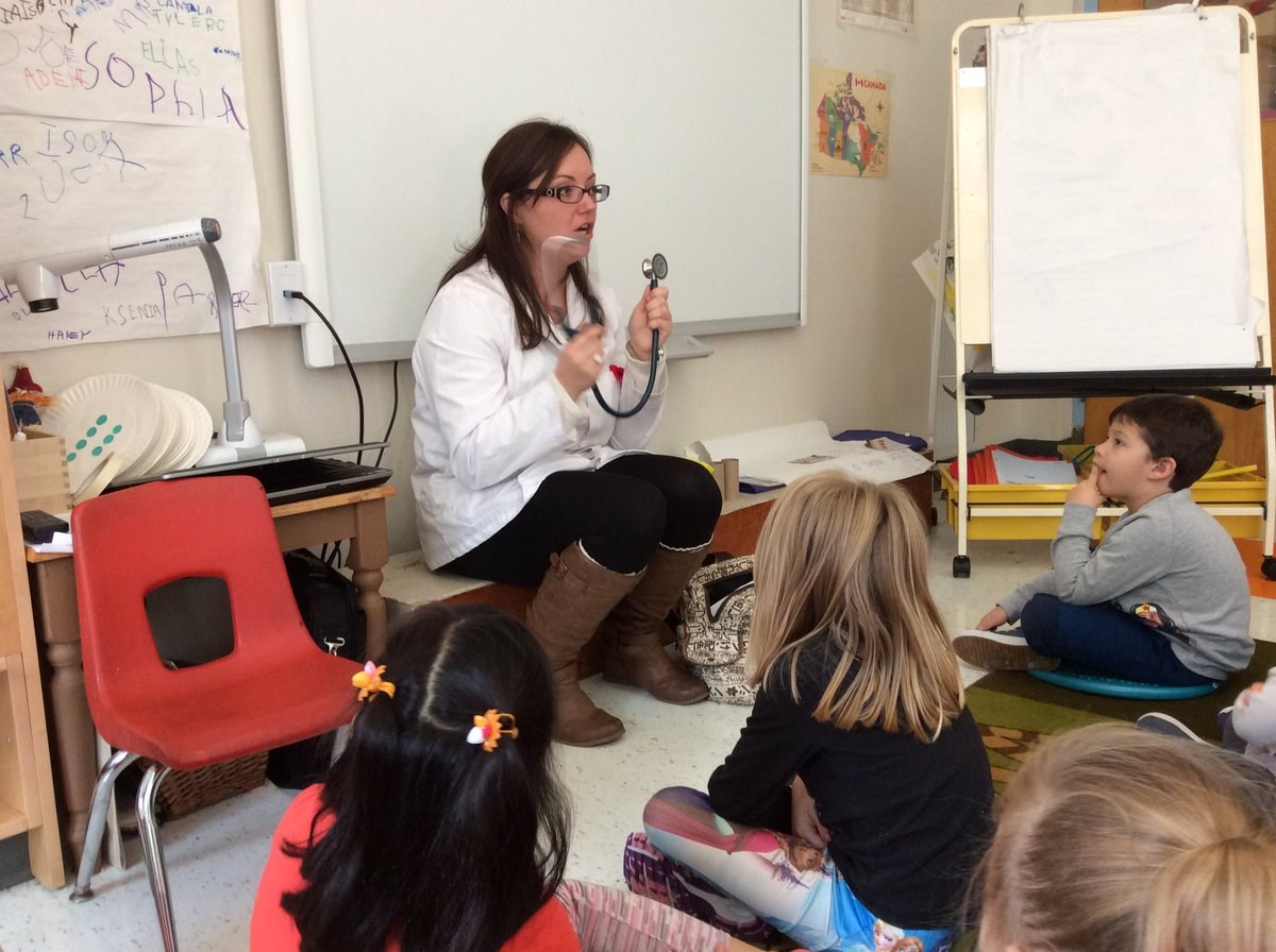 Volunteer talking with class