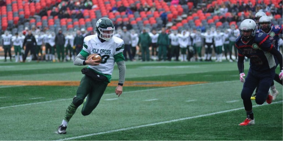 Football players running on field