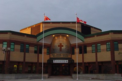 Holy Cross main entrance at sunrise.jpg