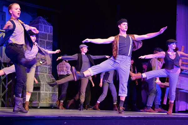 The dance ensemble perform in Newsies.jpg