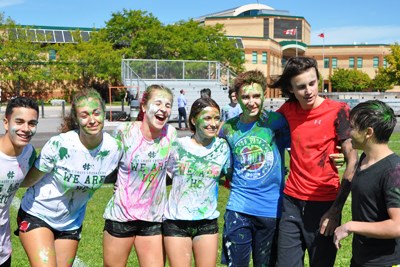 Grade 9 students laughing in a group at orientation