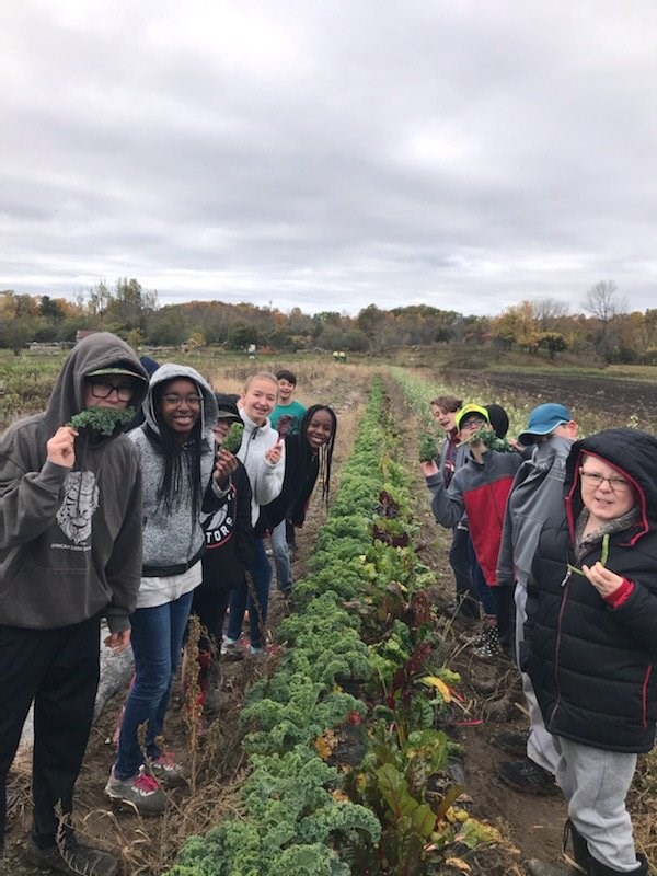 Students learning on-site at our Community Garden supported by the Loving Spoonful Grow Project