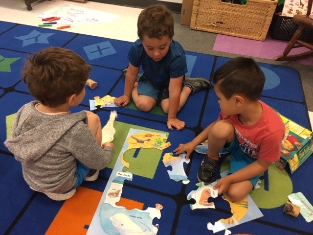 Kids playing with puzzle