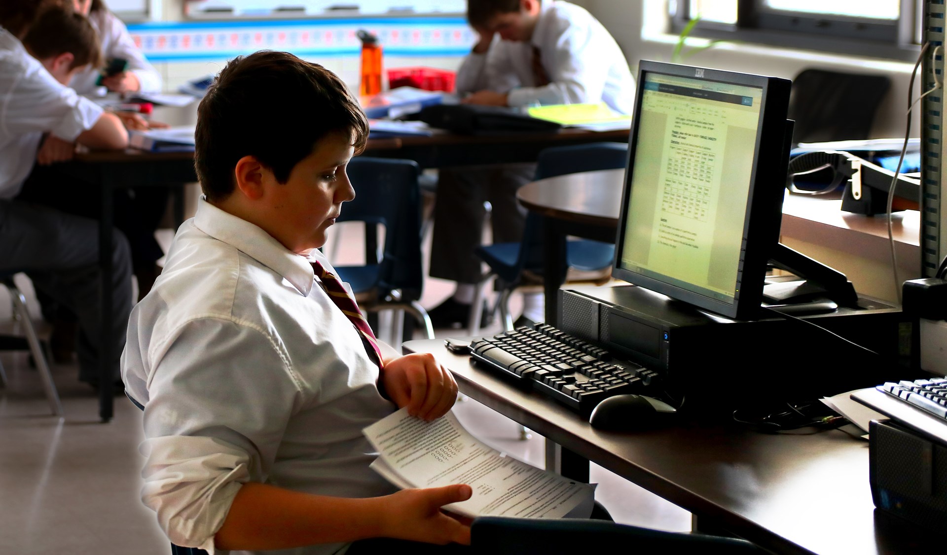 Student working at computer.