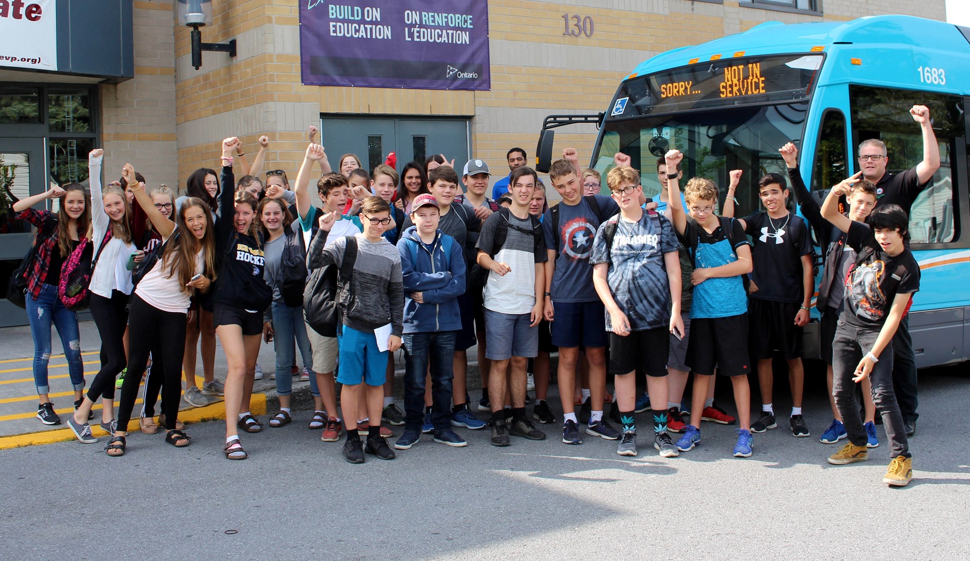 Students in front of city bus