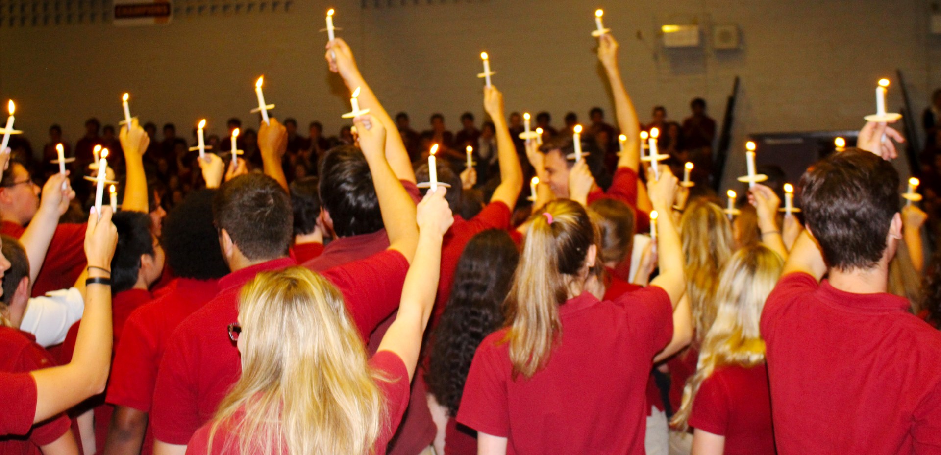 Students holding candles