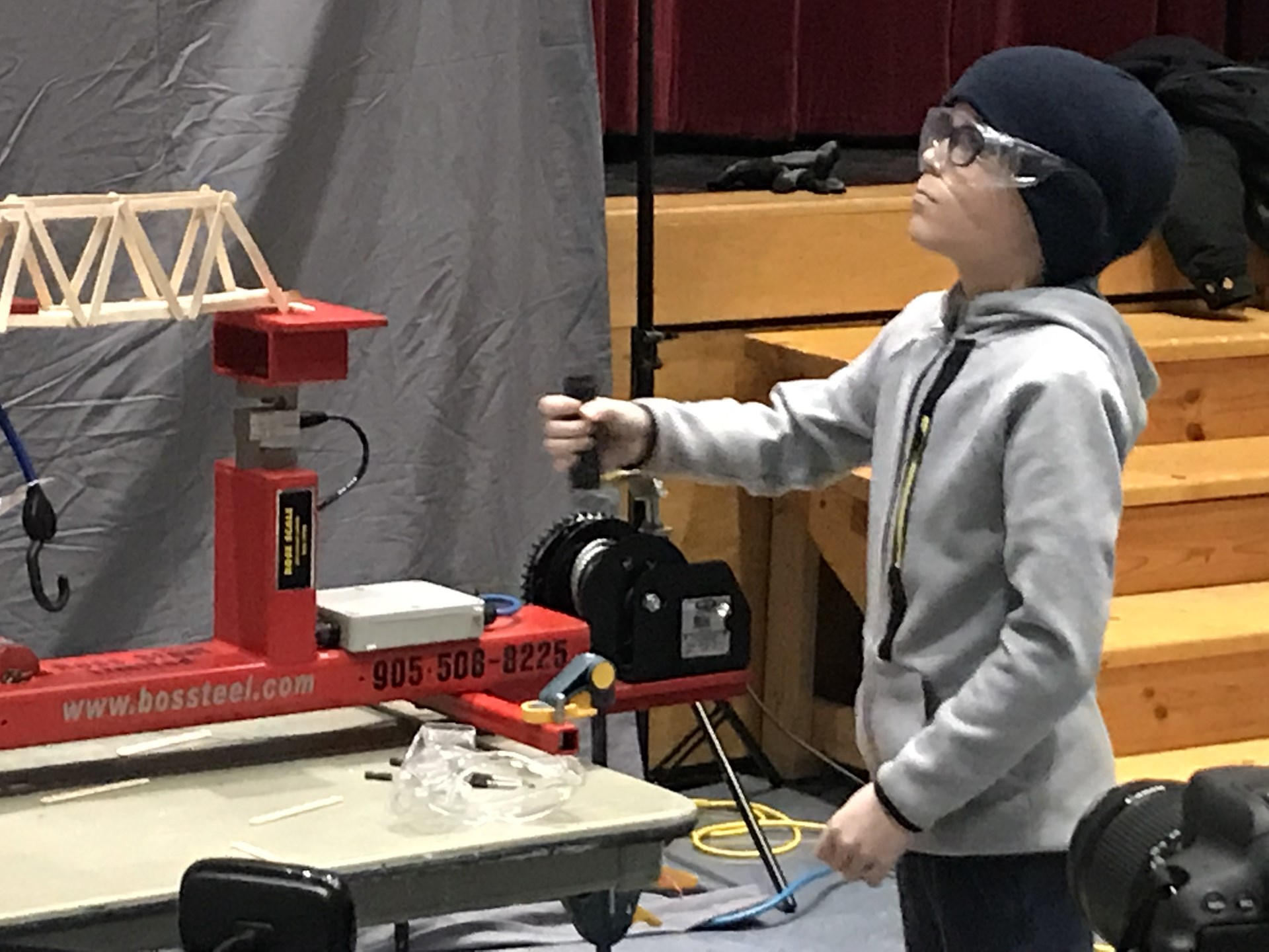 Student testing his bridge.